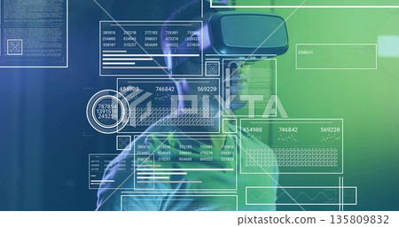 Exploring man wearing casual t-shirt using VR headset in virtual lab, with floating panels 135809832