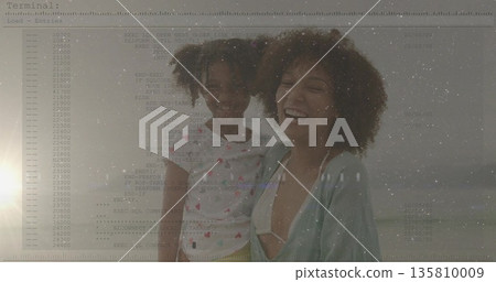Smiling mother in swimwear hugging daughter in patterned tshirt at beach, code overlay and waves Smiling mother in swimwear hugging daughter in patterned tshirt at beach, code overlay and waves 135810009