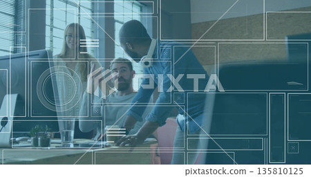 Collaborating professionals discussing project at desk in modern office, with monitor and plants Collaborating professionals discussing project at desk in modern office, with monitor and plants 135810125