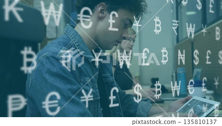Using keyboard adult male holding tablet in office, with monitors, mug, can and currency overlays Using keyboard adult male holding tablet in office, with monitors, mug, can and currency overlays 135810137
