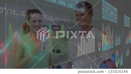 Smiling fitness partners wearing activewear holding water bottles in gym, with analytics overlays 135810140