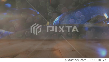 Showing wooden tabletop reflecting colorful bokeh lights in studio, warm background Showing wooden tabletop reflecting colorful bokeh lights in studio, warm background 135810174