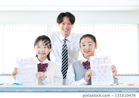 Female junior high school student showing answer sheet Female junior high school student showing answer sheet 135810476