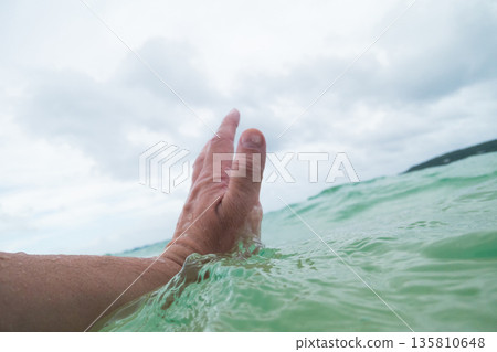 man drowning in the sea 135810648