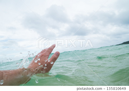 man drowning in the sea 135810649