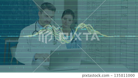 Female nurse and male physician reviewing patient data in clinic, with laptop, chart, stethoscopes Female nurse and male physician reviewing patient data in clinic, with laptop, chart, stethoscopes 135811000