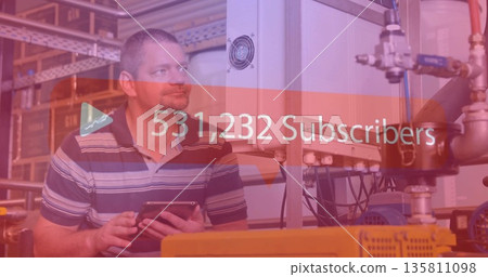 Monitoring tech holding tablet checking panel in plant with overlay showing 531,232 Subscribers Monitoring tech holding tablet checking panel in plant with overlay showing 531,232 Subscribers 135811098