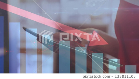 Woman in red sleeveless top tapping tablet in workspace, with bar chart, red arrow, copy space 135811103