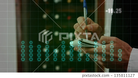 Monitoring technician inputting data with stylus at data center racks, with tablet and overlay Monitoring technician inputting data with stylus at data center racks, with tablet and overlay 135811127