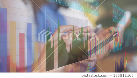 Holding stylus and smartphone, hands wearing business shirt scanning charts and tickers in office Holding stylus and smartphone, hands wearing business shirt scanning charts and tickers in office 135811165