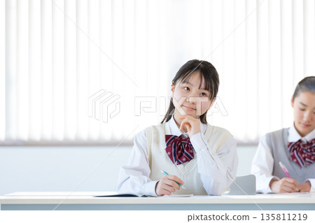 Junior high school girls studying at cram school Junior high school girls studying at cram school 135811219