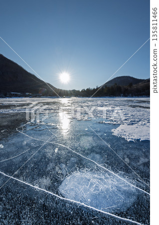 Morning sun and frozen ice bubbles on Mount Akagi's Lake Onuma 135811466