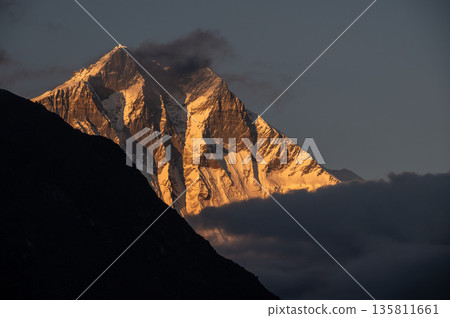 Beautiful view of Mt.Lhotse (8,516 m) at sunset seen from Khumjung village, Nepal. Mt.Lhotse the fourth highest mountain in the world at 8,516 metres on the way to Everest base camp in Nepal. Beautiful view of Mt.Lhotse (8,516 m) at sunset seen from Khumjung village, Nepal. Mt.Lhotse the fourth highest mountain in the world at 8,516 metres on the way to Everest base camp in Nepal. 135811661