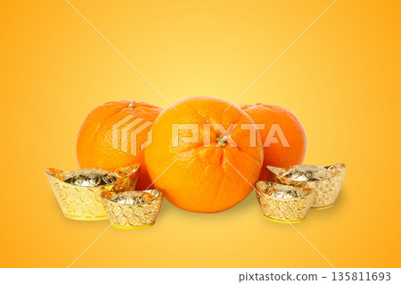 Oranges and gold ingots display festive symbols for the holiday 135811693