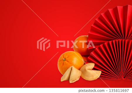 Colorful decorations feature oranges and fortune cookies Colorful decorations feature oranges and fortune cookies 135811697