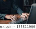 A person types on a laptop with glowing digital icons of a padlock, cloud storage, and database, symbolizing cybersecurity, secure data management, online protection, and digital information security. 135811909