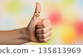 Hand giving thumbs up with colorful abstract background 135813969
