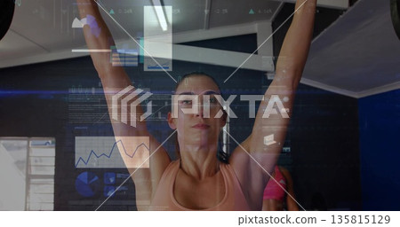 Lifting woman in peach sports bra gripping overhead bar in fitness studio, with metrics overlay Lifting woman in peach sports bra gripping overhead bar in fitness studio, with metrics overlay 135815129