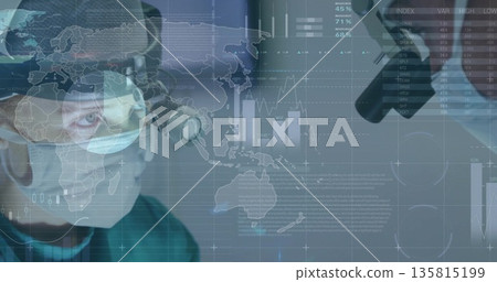 Performing surgeon in green scrubs using loupe under microscope in OR with data overlay, copy space Performing surgeon in green scrubs using loupe under microscope in OR with data overlay, copy space 135815199