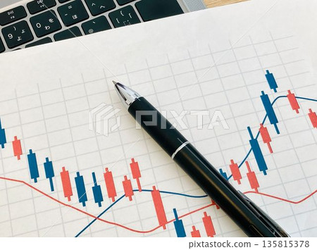 Stock chart and ballpoint pen Stock chart and ballpoint pen 135815378