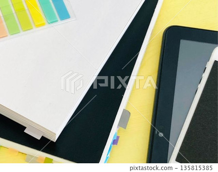 Books, notebooks, tablet and smartphone on the desk Books, notebooks, tablet and smartphone on the desk 135815385