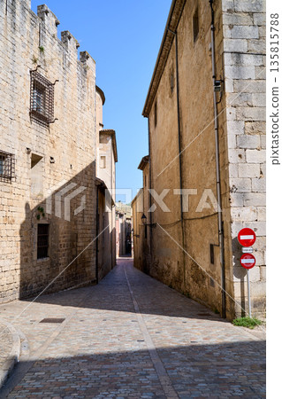 A Medieval street with stairs in the city of Girona, Catalonia, Spain. A Medieval street with stairs in the city of Girona, Catalonia, Spain. 135815788