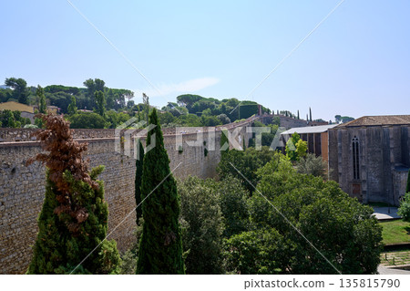 Ancient City Boundary Extending Through Lush Valley With Cypress Shadows And Scenic Historic Outlook Ancient City Boundary Extending Through Lush Valley With Cypress Shadows And Scenic Historic Outlook 135815790