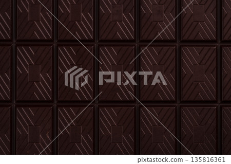 Dark chocolate bar texture background with geometric pattern Dark chocolate bar texture background with geometric pattern 135816361