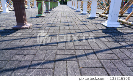 Close Up of Pavement Shadows from Bamboo Structure Close Up of Pavement Shadows from Bamboo Structure 135816508