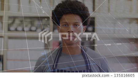 Man in grey shirt and striped apron standing in storeroom, with metal shelving and digital grid Man in grey shirt and striped apron standing in storeroom, with metal shelving and digital grid 135816605