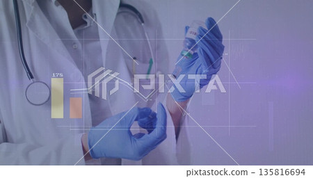Filling syringe from vial, lab coat wearing doctor using blue gloves in clinic, with digital charts 135816694