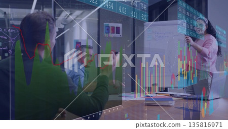 Presenting team lead in pink blouse holding flipchart in glass room with data charts, copy space Presenting team lead in pink blouse holding flipchart in glass room with data charts, copy space 135816971