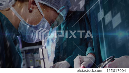 Leaning female surgeon holding scalpel over patient in OR with forceps and monitors, copy space Leaning female surgeon holding scalpel over patient in OR with forceps and monitors, copy space 135817004