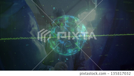 Holding microphone speaker in blazer demonstrating rotating digital sphere on stage, with waveform 135817032
