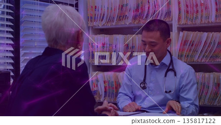 Doctor in shirt with stethoscope reviewing patient file speaking in office near shelves, copy space Doctor in shirt with stethoscope reviewing patient file speaking in office near shelves, copy space 135817122