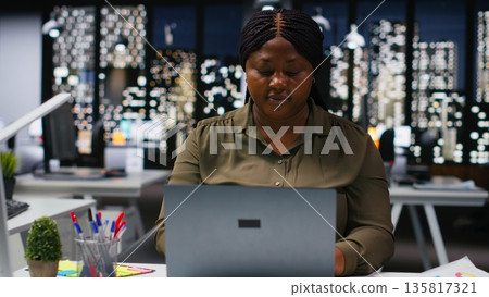 Woman business assistant at office sharing insights and data reports, focusing on budgeting and projections for efficient resource allocation. Successful company administration. Camera B. Woman business assistant at office sharing insights and data reports, focusing on budgeting and projections for efficient resource allocation. Successful company administration. Camera B. 135817321