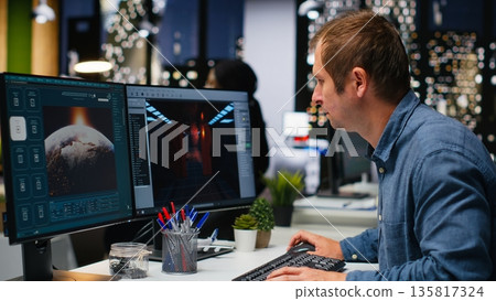 Game developer utilizes AI generated program to design spaceship station using deep learning, futuristic environment enhanced by machine learning solutions and cloud computing. Camera B. Game developer utilizes AI generated program to design spaceship station using deep learning, futuristic environment enhanced by machine learning solutions and cloud computing. Camera B. 135817324