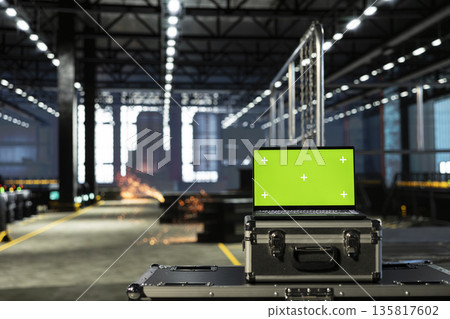 Chroma key in empty industrial warehouse with structured beams and machinery, metal equipment positioned across a clean plant floor. Heavy industry construction for production line. 135817602