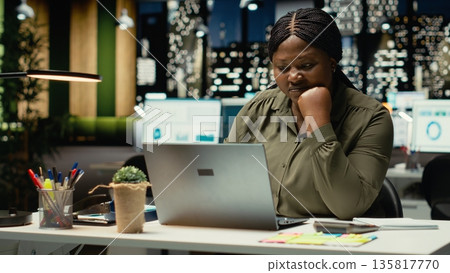 Female entrepreneur sighing being drained and overwhelmed after hours, pushing limits despite clear signs of fatigue and tension. Workplace challenges and discouragement bring discomfort. Camera B. Female entrepreneur sighing being drained and overwhelmed after hours, pushing limits despite clear signs of fatigue and tension. Workplace challenges and discouragement bring discomfort. Camera B. 135817770