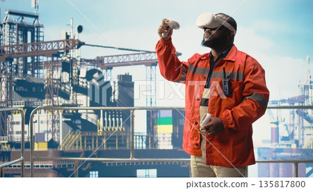 Offshore rig worker supervising deck operations using virtual reality simulation, ensuring compliance with safety protocols. Engineer doing checkup on drilling rig with VR goggles, Offshore rig worker supervising deck operations using virtual reality simulation, ensuring compliance with safety protocols. Engineer doing checkup on drilling rig with VR goggles, 135817800