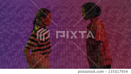 Facing women holding basketball in studio wearing striped red polo shirts with binary-code backdrop Facing women holding basketball in studio wearing striped red polo shirts with binary-code backdrop 135817934