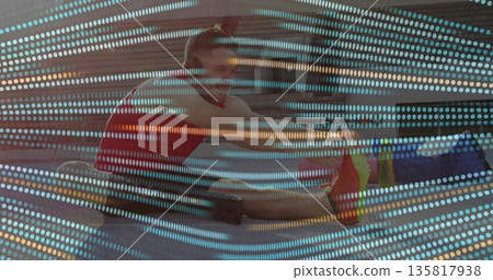 Performing seated hamstring stretch man in bright red tank top on urban plaza with grid overlay 135817938