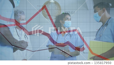 Discussing trends on line graph overlay in hospital corridor with clipboard tablet stethoscopes Discussing trends on line graph overlay in hospital corridor with clipboard tablet stethoscopes 135817950
