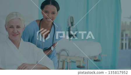 Nurse in scrubs checking patient in gown in ward, with stethoscope and wheelchair, copy space Nurse in scrubs checking patient in gown in ward, with stethoscope and wheelchair, copy space 135817952