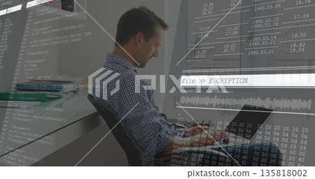 Working developer at office desk typing code on laptop with code overlay graphics, copy space 135818002