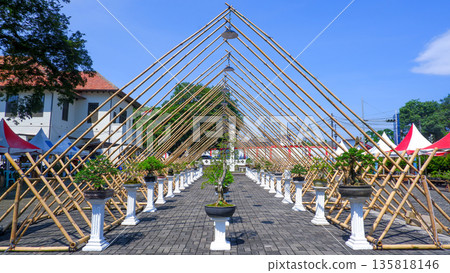 Symmetry Bamboo Tunnel for Bonsai Exhibition in Front of Colonial Building Symmetry Bamboo Tunnel for Bonsai Exhibition in Front of Colonial Building 135818146