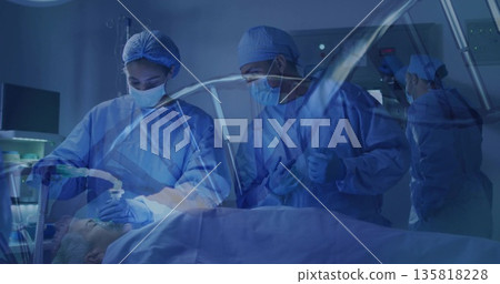 Adjusting mask and tube as surgeon holding tool above patient in OR, with vitals monitor 135818228