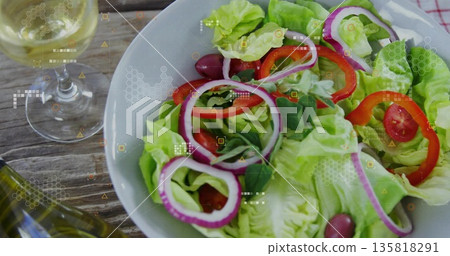 Showing salad bowl with lettuce, tomatoes, olives and basil on rustic table, with digital overlay Showing salad bowl with lettuce, tomatoes, olives and basil on rustic table, with digital overlay 135818291
