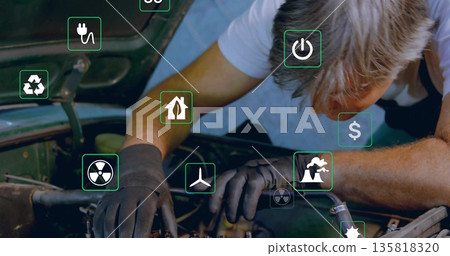 Inspecting mechanic wearing black gloves examining engine under hood in garage, with floating icons Inspecting mechanic wearing black gloves examining engine under hood in garage, with floating icons 135818320