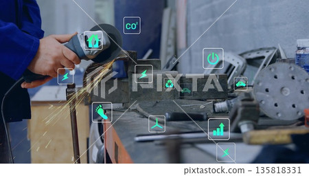 Metalworker hands grinding steel with angle grinder in machine shop, with digital icons, copy space 135818331